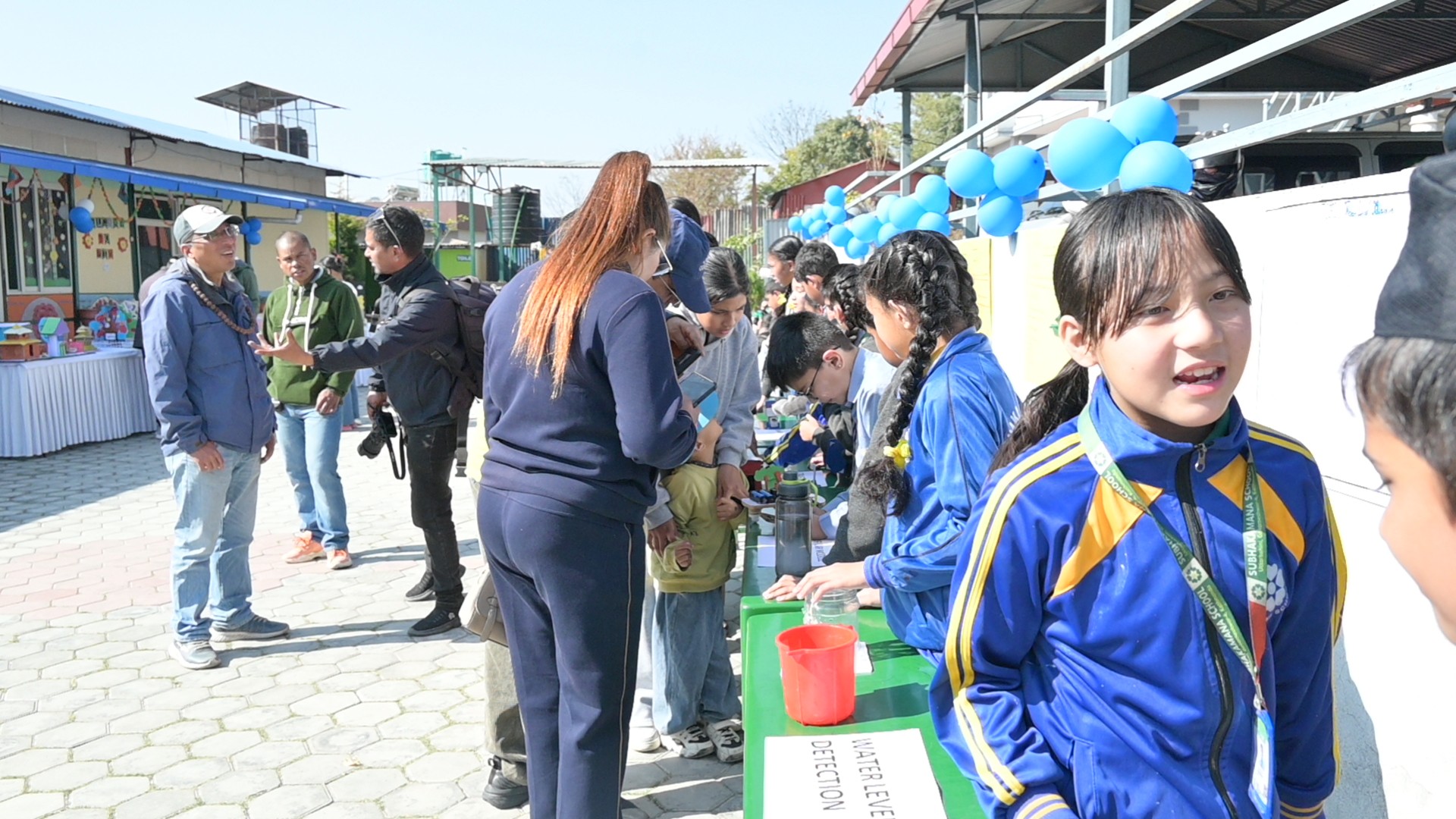 Students of Subhakamana School in the courtyard
